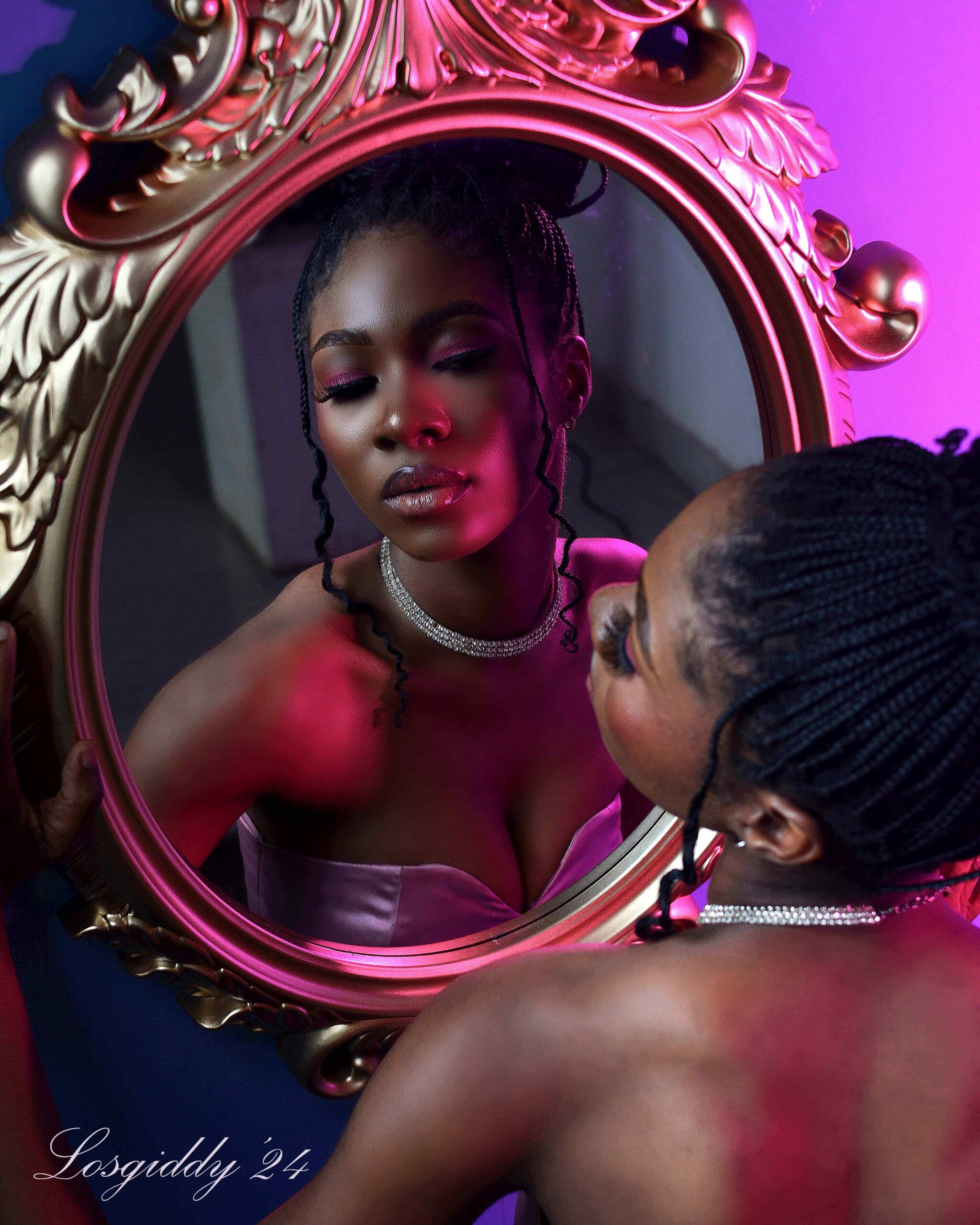 Graded beauty portrait — dark skin tones held clean under magenta gel lighting, Losgiddy School of Photography Lagos